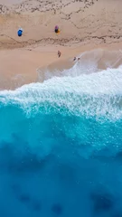 Stoff pro Meter Aerial drone aerial shot in summer on paradise sandy beach Megali Petra in Lefkada. Beautiful crystal clear turquoise and blue waters. Greece. vertical photo © unai