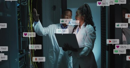 Animation of notification bars over diverse engineers discussing on laptop in server room - Powered by Adobe