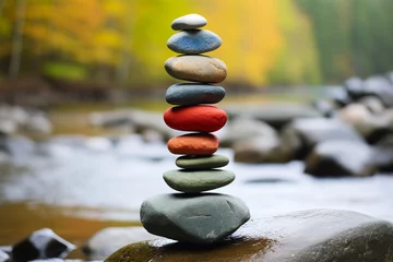 Papier Peint photo Pierres dans le sable colored zen stones in stream in autumn winter setting, balance stack of zen stones, serene beauty of a riverbank or shore, rocks and water coexist in a tranquil dance of reflections and textures