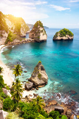 Tropical beach with white sand and palm trees, beach holiday destination on Bali island