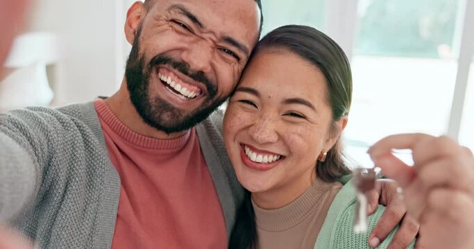 Couple, selfie and keys to new house with a smile, love and excited about moving in together. Social media, profile picture and interracial man and woman with mortgage, rent or loan for real estate