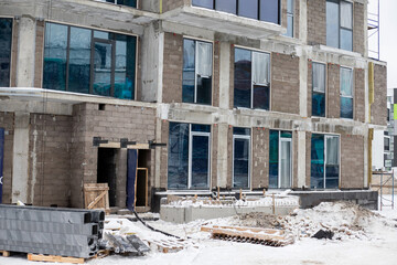 View of a construction site where an old building is being renovating in winter