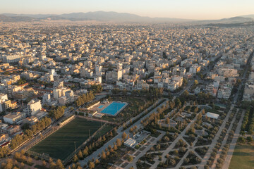 Fototapeta na wymiar Aerial View of Athens' National Opera House Amidst Verdant Parklands