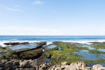 Sawarna beach,west Java,Indonesia, beautiful beach with coral reefs dotted with greenery 