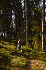 Fototapeta na wymiar Beautiful forest sunset pines woods girl tourist