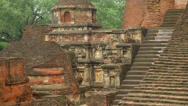 The main temple dome with Buddha statues ruins on the site of Nalanda Mahavihara the oldest Buddhist monastic university that was demolished by Mughal Invaders, Closeup shot