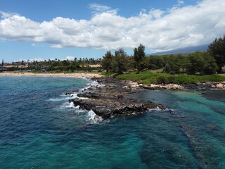 Waves hitting the beach in Maui, Hawaii