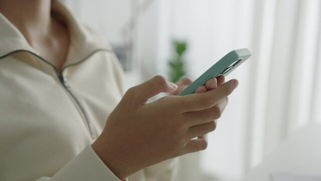 Hand. Asian beautiful teenager girl using texting mobile phone or chat