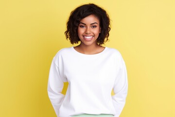 Obraz premium female wearing white sweatshirt on yellow background for mock up