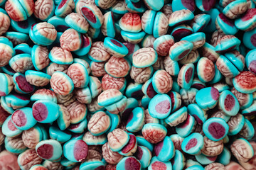 Fototapeta na wymiar Close up view of assorted colorful brain shape jelly candies, delicious colorful Halloween sweets.