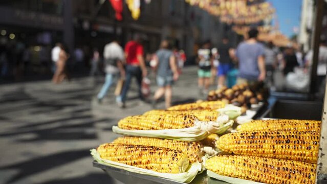 Close up of many famous turkey grilled corn on the cob In the cart on Istiklal Avenue. Popular street food in Istanbul