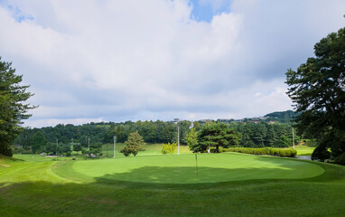 Green grass Golf course cloud and blue sky