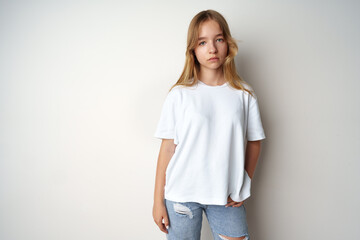Obraz premium Portrait of young beautiful cute teen girl posing at camera