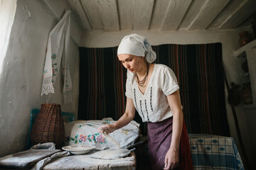 The process of baking homemade bread in wood-fired ovens.