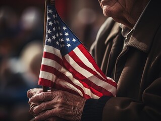 Alder's wrinkled hand holds a small American flag during a parade. The scene conveys generations of pride and tradition, framed perfectly to capture the emotion and nostalgia.