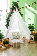 Christmas interior of a children's room with teepee