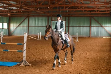 Foto auf Alu-Dibond beautiful horse rider is training, equestrian sports © Екатерина Переславце