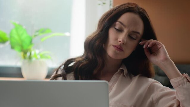Caucasian pensive adult girl young woman businesswoman with laptop thinking business idea working with computer remote freelance task thoughtful think confused puzzled concerned problem at home office