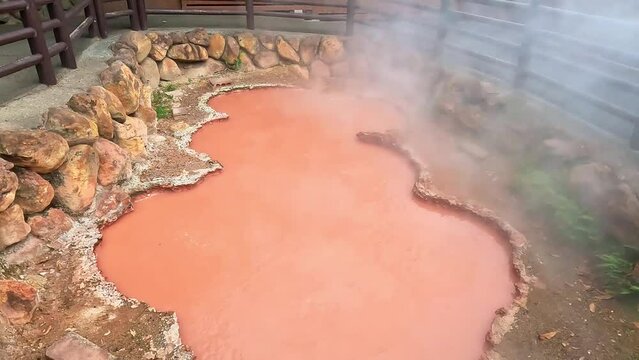 Hot spring water (Hells), red pond in Umi Jigoku at Beppu, Oita-shi, Kyushu, Japan