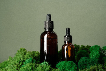 Vape smoking liquid bottles on moss background