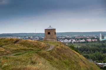 Fototapeta na wymiar One of the towers of the ancient fortress of the ancient Bulgarian Yelabuga settlement and view of the city in the Republic of Tatarstan, Russia