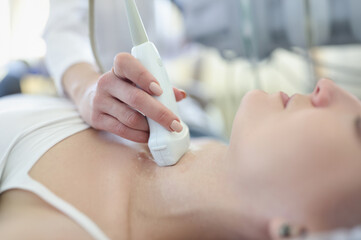 Diagnostics of ultrasound of thyroid gland in woman. Thyroid disease in women concept