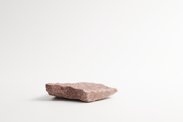 Red pink flat textured stone pedestal on white background, template for mock-up, banner. Minimal concept, empty podium display product, presentation scene
