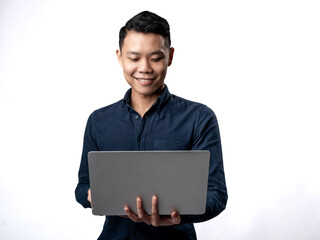 A portrait of an Asian man wearing a blue shirt, working while carrying a laptop, isolated with a white background.