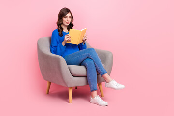 Full size portrait of gorgeous intelligent girl sit comfort chair read book empty space isolated on...