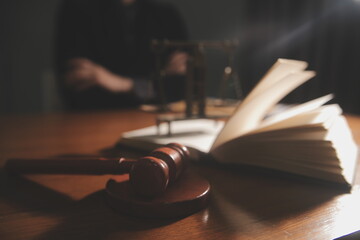 Business and lawyers discussing contract papers with brass scale on desk in office. Law, legal...