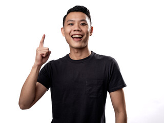 A portrait of an Asian man wearing a black t-shirt,  pointing in a certain direction with both hands, isolated on a white background.