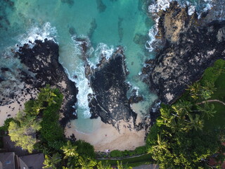 Waves hitting the beach in Maui, Hawaii