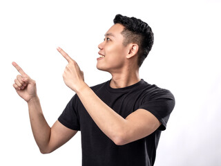 A portrait of an Asian man wearing a black t-shirt,  pointing in a certain direction with both hands, isolated on a white background.