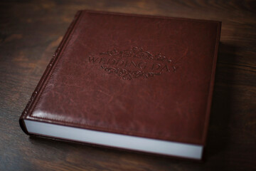 Wedding photobooks in brown leather binding. Wedding photo book, album family album. Photo books with embossing and a cover of genuine leather. Services of a professional photographer and designer.