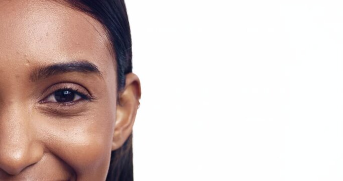 Eye, mockup and half face with an indian woman in studio isolated on a white background for beauty marketing. Portrait, skincare and advertising with a young person on space for a cosmetics logo
