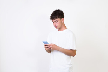 Happy caucasian young man using smart phone cellphone for calls, social media, mobile application online isolated in white background