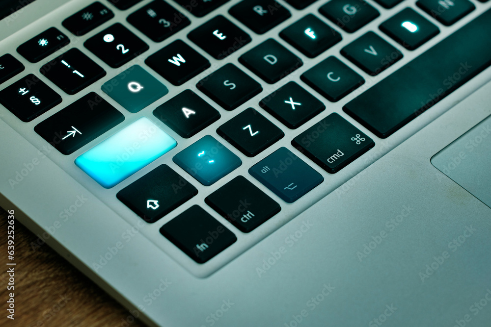 Poster Laptop, keyboard and shift key glow on a desk closeup for networking, typing or blogging in an office. Computer, technology and email connection with futuristic web browsing on a table from above