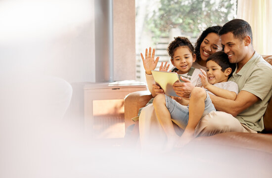 Tablet, video call and family with wave, love and smile on a living room sofa at home. Mother, dad and children together with online communication of parents and kids with discussion and mockup space