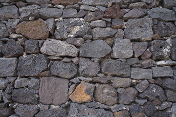 Rock wall background. Stone wall texture. Detail of a traditional dry stone wall