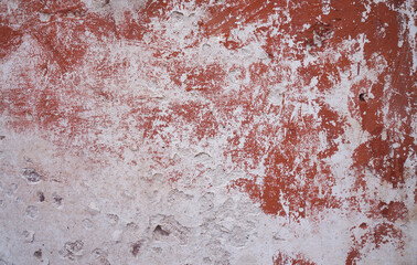 Cement texture. Brick wall. Old flaky white paint peeling off a grungy cracked wall.