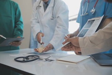 international team of professional doctors having a meeting in conference room at the modern...