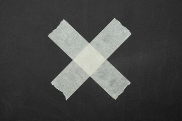 Obraz premium cross, close up of an adhesive tape