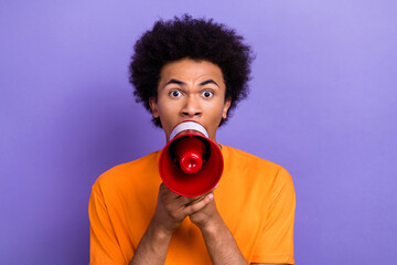 Photo crazy annoyed irritated guy youngster hold megaphone screaming his rules revolution change world isolated on violet color background