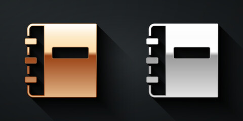 Gold and silver Notebook icon isolated on black background. Spiral notepad icon. School notebook. Writing pad. Diary for school. Long shadow style. Vector