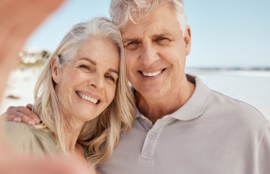 Old couple, selfie and smile in portrait on beach, love and travel with social media memory and wellness. Hug, smile in picture and trust, commitment and partner with marriage, retirement and holiday
