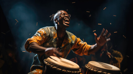African man plays the drumming drum in national dress. - obrazy, fototapety, plakaty