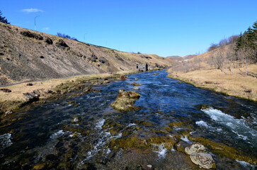 Fototapeta na wymiar Fast Flowing River in Rural Remote Iceland