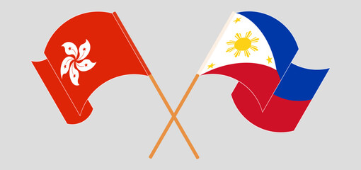 Crossed and waving flags of Hong Kong and the Philippines