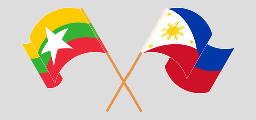 Fototapeta na wymiar Crossed and waving flags of Myanmar and the Philippines
