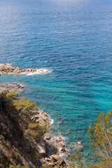 Idyllic Spanish Beach with Rocky Coastline, Vertical View